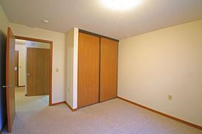 Delano apartment for rent - a bedroom with a closet and a door to a hallway