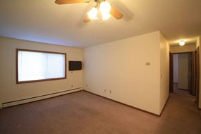 Monticello townhouse for rent - a living room with a ceiling fan and a large window