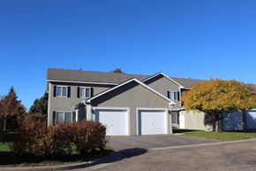 St. Louis Park townhouse for rent - a house with a garage door in front of it