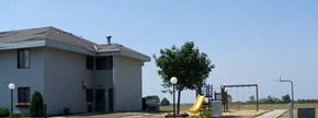 Pierz apartment for rent - a white building with a playground next to it