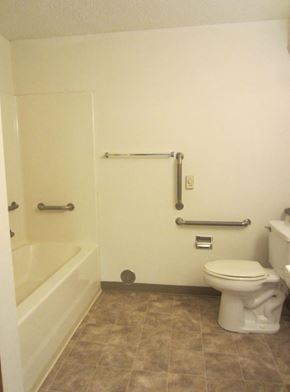 Pierz apartment for rent - a bathroom with a toilet and a bath tub