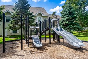 Eden Prairie townhouse for rent - A playground with a slide, swings, and a climbing frame.