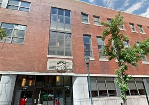 Philadelphia apartment for rent - a brick building with a lion statue on the side of it