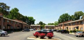 Newport News apartment for rent - a city street with cars parked in front of apartment buildings