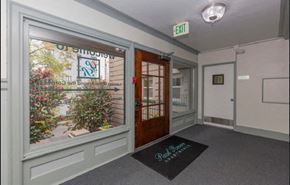 Seattle apartment for rent - the entrance of a building with a large window and a door
