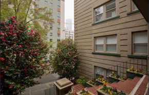 Seattle apartment for rent - a view of the street from a balcony of an apartment building