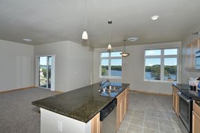 Menomonie apartment for rent - a large kitchen with granite counter tops and a large island