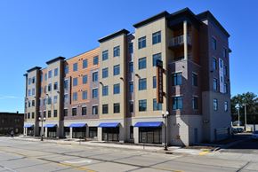 Menomonie apartment for rent - a large apartment building on the corner of a city street