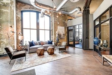 Wheeling apartment for rent - a living room with a couch and a table
