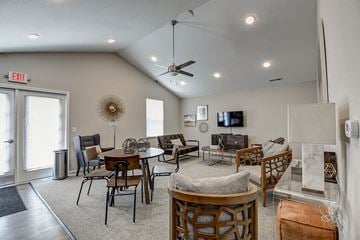 Wheeling apartment for rent - a living room with furniture and a ceiling fan