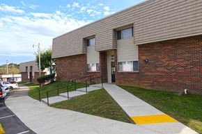 Scottsville apartment for rent - a brick building with a sidewalk in front of it