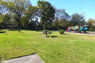 Nashville apartment for rent - a park with a playground and a picnic table