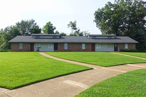 New Albany apartment for rent - a house with a lawn and a sidewalk in front of it