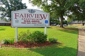 New Albany apartment for rent - a sign for fairview apartments on the side of the street