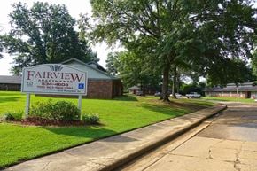 New Albany apartment for rent - a sign for fairview apartments on the side of a street