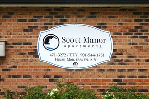 Sikeston apartment for rent - a sign on the side of a brick building