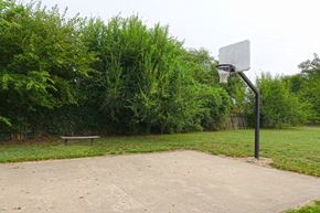 Sikeston apartment for rent - a basketball hoop and a bench in a park