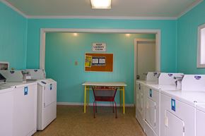 Sikeston apartment for rent - a room with many machines and a table in the middle