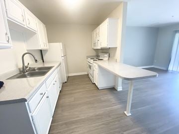 La Mesa apartment for rent - a kitchen with white cabinets and a sink and a counter