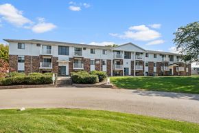 Wyoming apartment for rent - Apartment building with a green lawn in front.