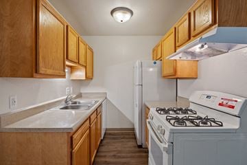 Wyoming apartment for rent - A kitchen with a stove and a refrigerator.