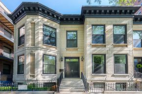 Chicago apartment for rent - the exterior of a house with a black door and stairs