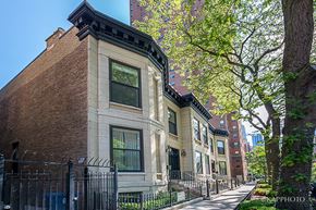 Chicago apartment for rent - a row of brick buildings on a city street