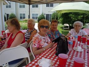 Pineville apartment for rent - A group of women are sitting at a picnic table.
