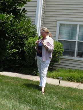 Pineville apartment for rent - A woman in a striped shirt and white pants is standing on a sidewalk.