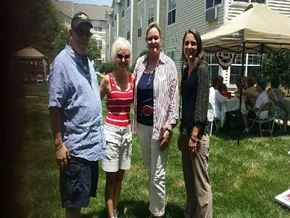 Pineville apartment for rent - Four people are standing in the grass.