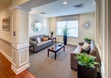 Oakhurst apartment for rent - a living room with couches and a table
