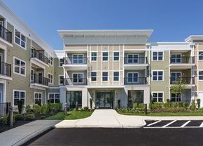 Port Monmouth apartment for rent - an exterior view of an apartment building with a sidewalk