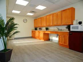 Bloomfield apartment for rent - a kitchen with wooden cabinets and a sink and a microwave