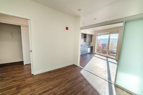 Seattle apartment for rent - a living room with a sliding glass door and a window