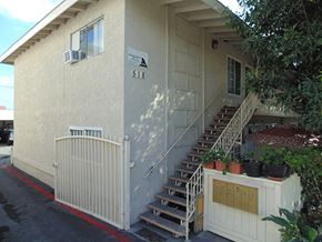Anaheim apartment for rent - the front of a house with stairs and a gate
