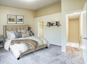 Hudsonville townhouse for rent - a bedroom with a bed and a door to a closet