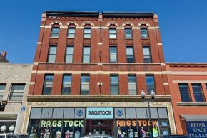 Chicago apartment for rent - a large brick building with a store in front of it
