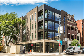 Chicago apartment for rent - a building on a city street with a van
