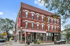 Chicago apartment for rent - a red brick building on the corner of a city street