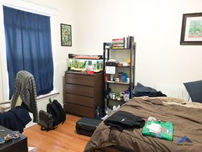 Chicago apartment for rent - a bedroom with a bed and a fish tank in it