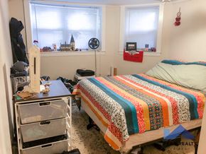 Chicago apartment for rent - a bedroom with a bed and a dresser