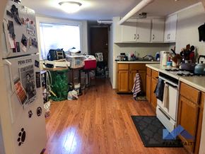Chicago apartment for rent - a cluttered kitchen with a stove and a refrigerator