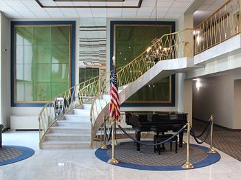 Elegant two-story lobby with grand piano