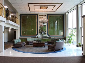 Elegant two-story lobby with grand piano