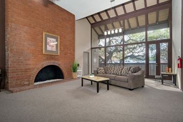 Thousand Oaks apartment for rent - a living room with a brick fireplace and a couch