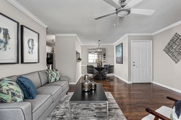 Memphis apartment for rent - A living room with a grey couch and a black coffee table.