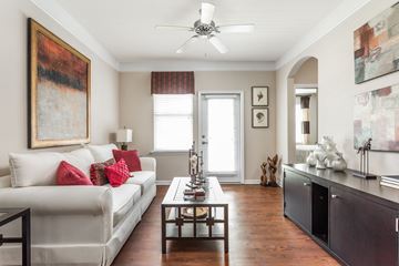 Goose Creek apartment for rent - A living room with a white couch and a painting on the wall.