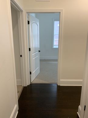 Evanston apartment for rent - a hallway with a door open to a bedroom and a door to a bathroom