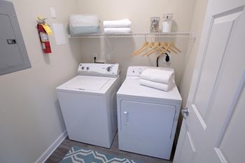A bathroom with a white toilet and sink.