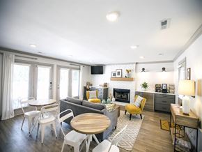 Raleigh apartment for rent - Resident clubroom with tables, couches, coffee bar and TV